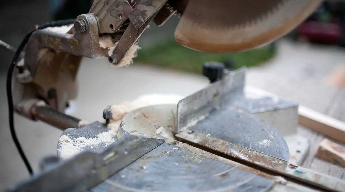 Cutting a pipe with a saw