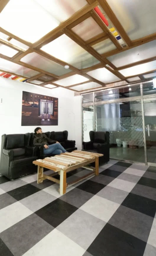 Lobby with a ceiling light made from old windows