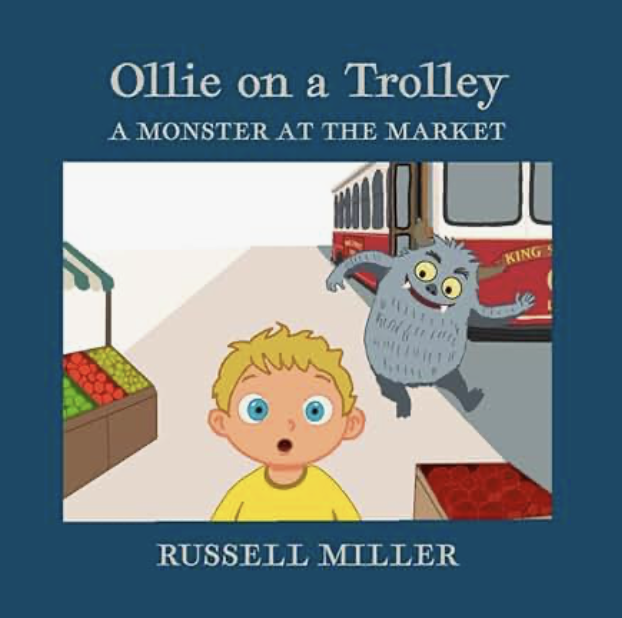 Book cover titled "Ollie on a Trolley: A Monster at the Market" by Russell Miller. Features a cartoon monster with gray fur and yellow eyes standing near a trolley, with a surprised child with blond hair and blue eyes in an indoor market setting.