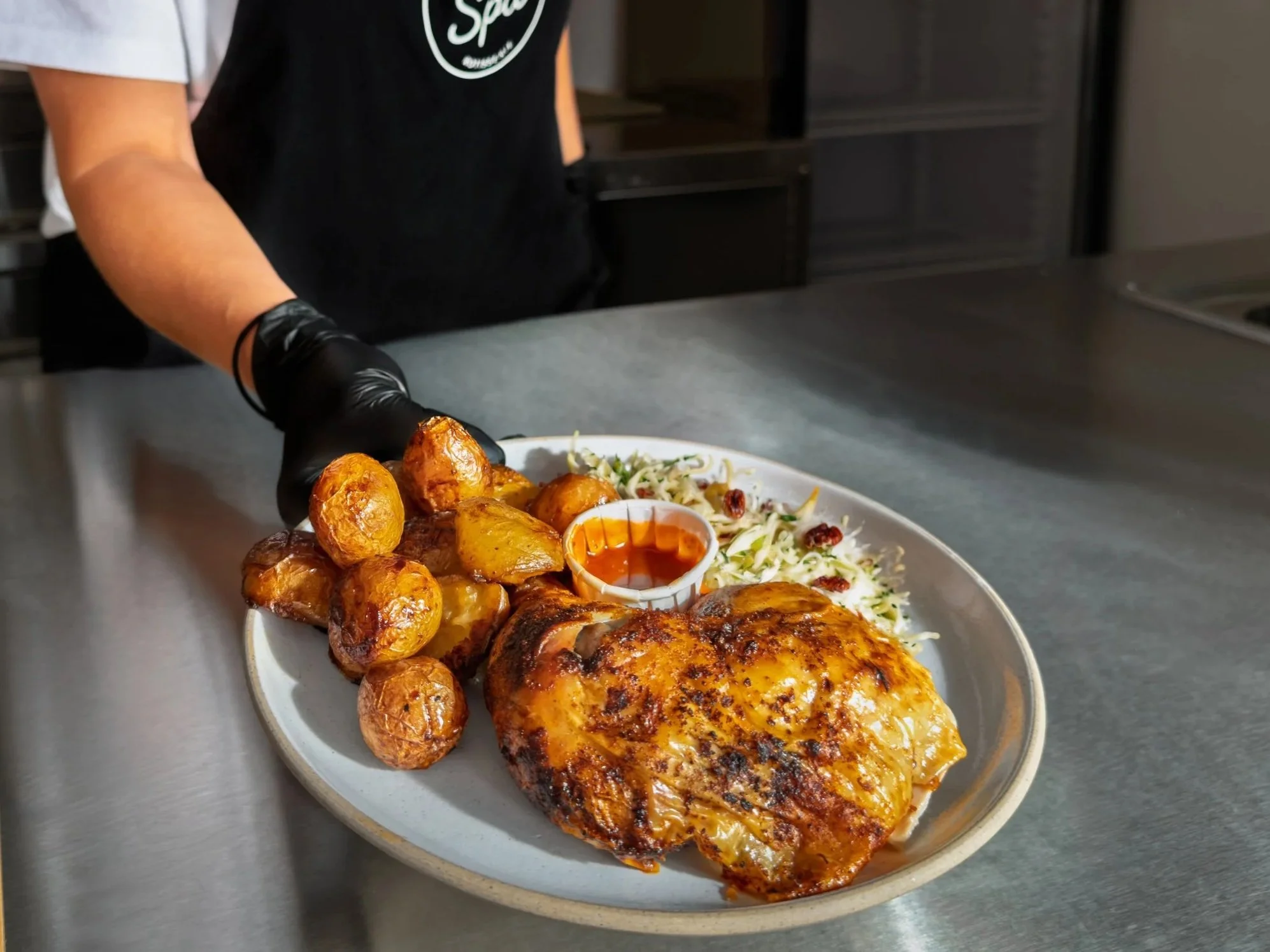 Half Rotisserie chicken + 2 sides + hot sauce