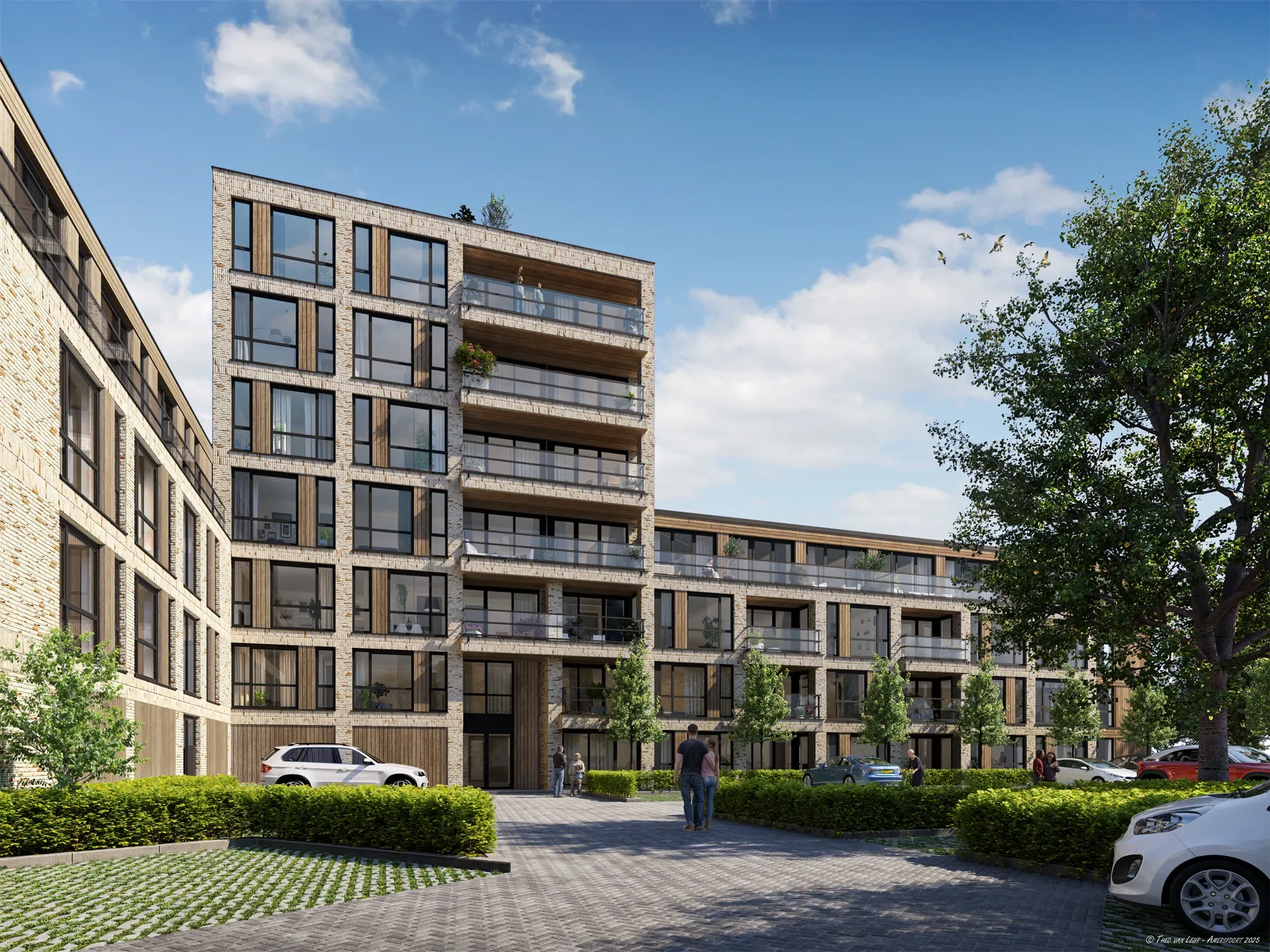 Moderne woontoren met grote ramen en balkons, omringd door groene beplanting en parkeerplaatsen, onder een blauwe hemel met enkele wolken.