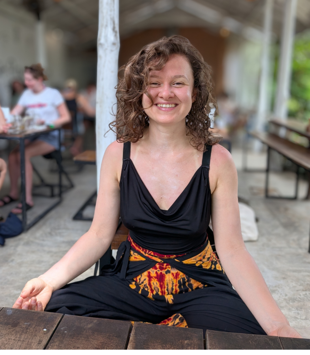 Laura demonstrating chair yoga, accessible yoga for ADHD