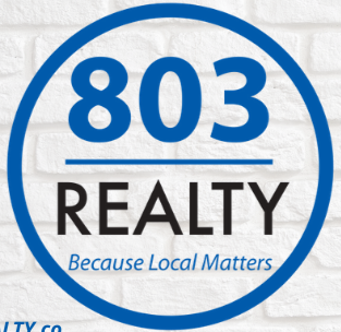 Logo of 803 Realty with a circular border, blue and black text, and the slogan 'Because Local Matters'.
