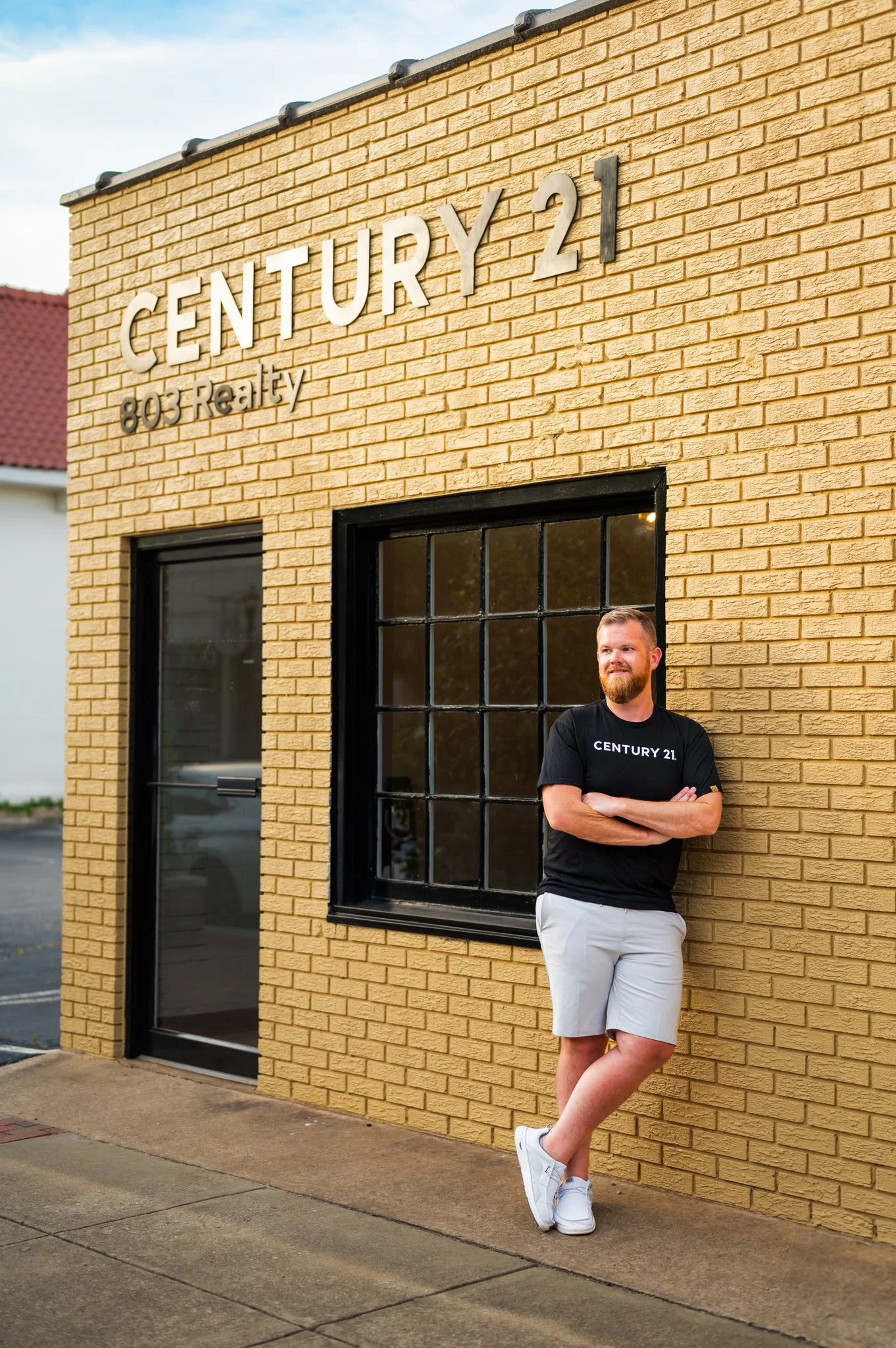 team member outside of Century 21 803 Realty lexington location