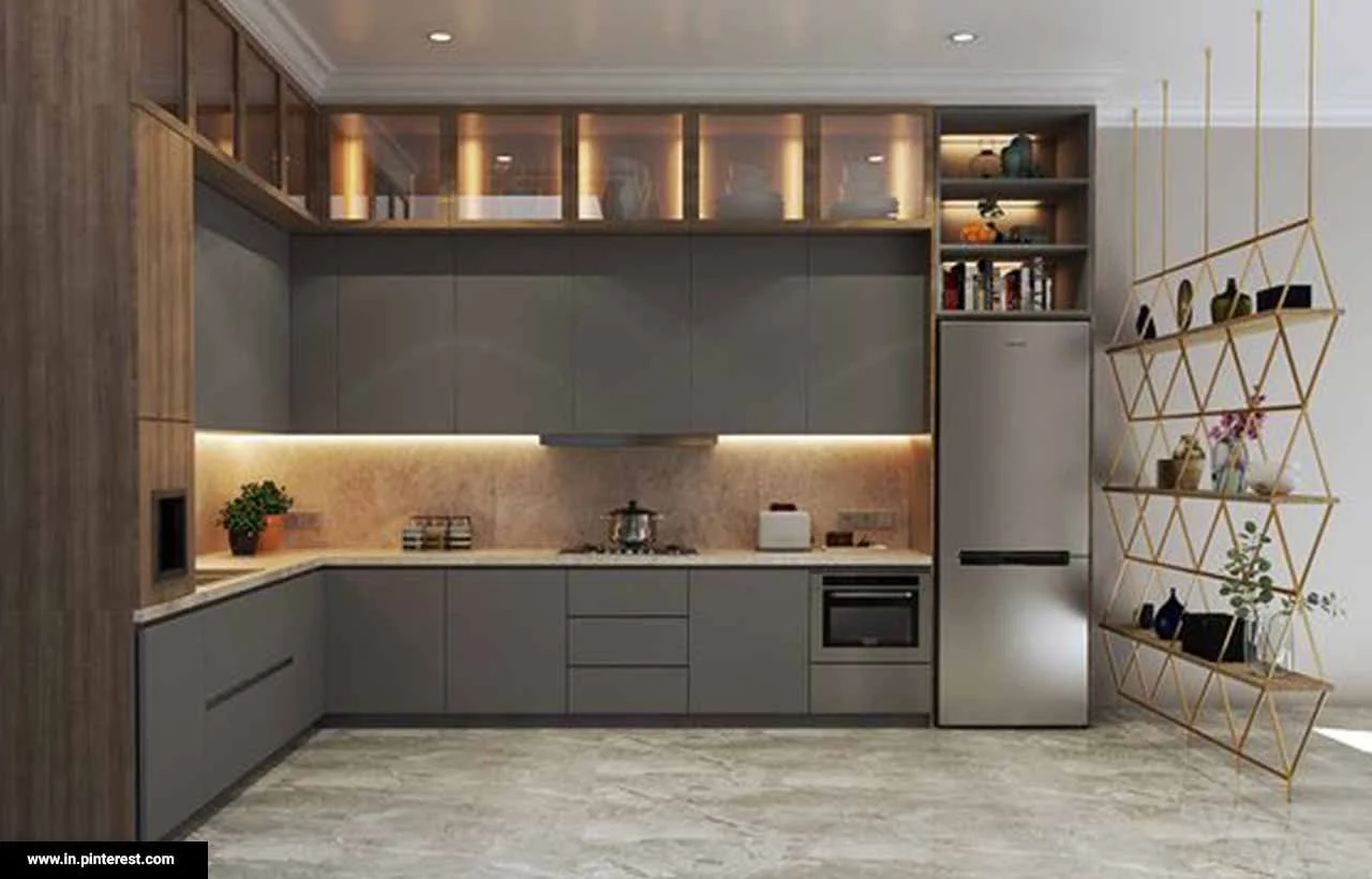 Modern kitchen with gray cabinets, a stainless steel refrigerator, open wooden shelves with decorative items, and a geometric metal shelf on the right with plants and dishes.