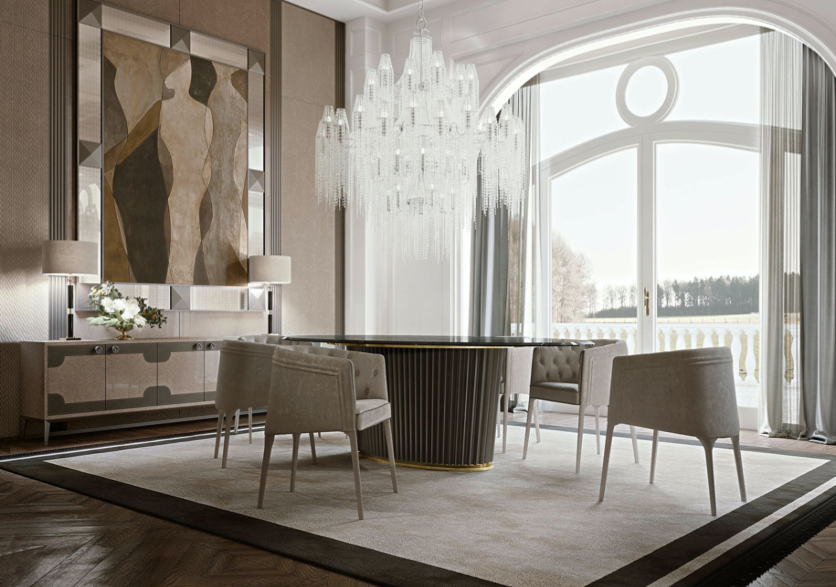 Elegant dining room with a round black table, five upholstered chairs, a large crystal chandelier, a sideboard with flower arrangements, and large arched window with sheer curtains in a luxurious setting.