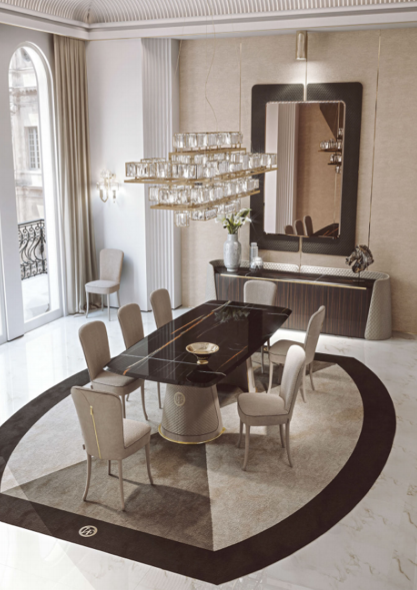 Elegant dining room with a black marble table, eight beige chairs, a large chandelier, a mirror, and a sideboard with decorative items.
