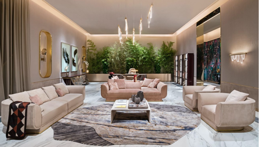 Elegant living room with modern furniture, artwork, greenery, and soft lighting.