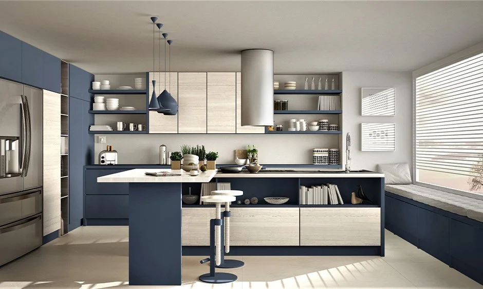 Modern kitchen with blue and white cabinetry, stainless steel refrigerator, open shelves with dishes, a kitchen island with stools, and large window with blinds.