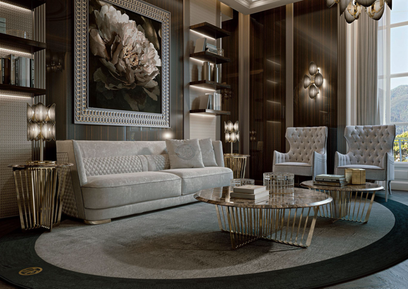 Luxurious living room with a white sofa, two white high-backed armchairs, a marble coffee table, gold side tables, and modern wall decor. Large window with a scenic view.