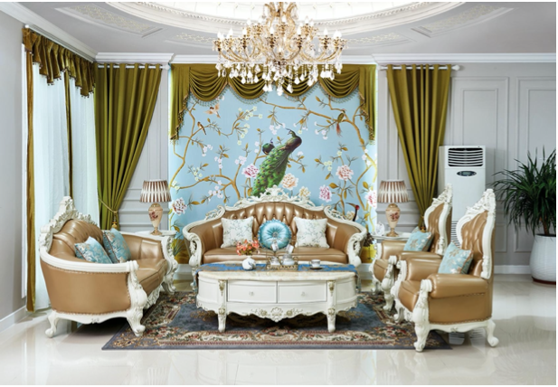 Elegant living room with gold and white furniture, green curtains, a chandelier, a mural of a peacock and flowers on the wall, and a patterned rug.