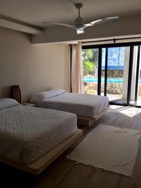 Beachfront room 2 double beds.jpeg