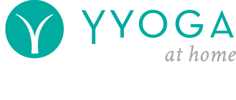 Logo for YOGA at home with a teal circle containing a white stylized yoga pose, and text reading 'YOGA at home'.