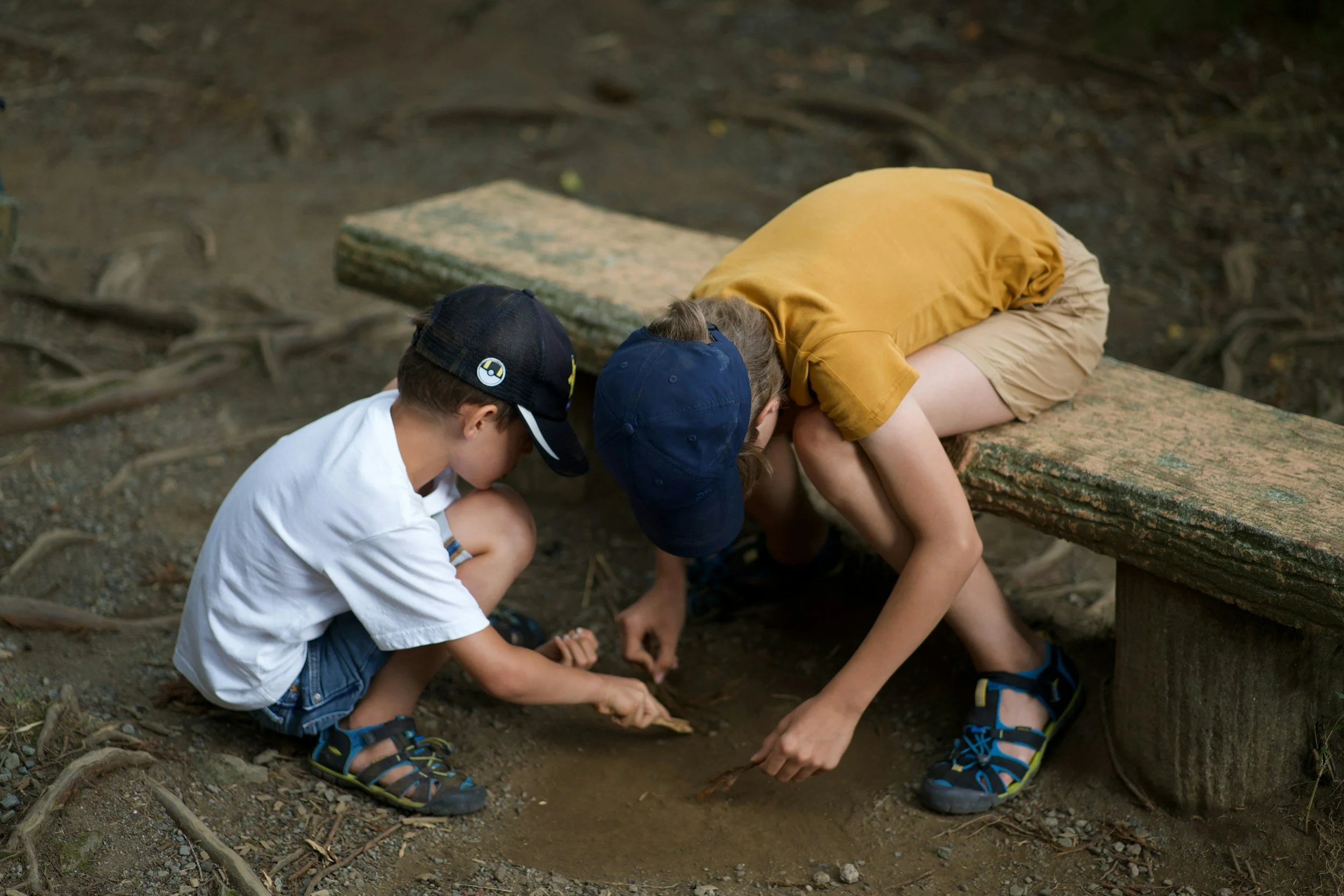 Two students exploring and learning together outdoors, representing ADHD support and resources for students and families.