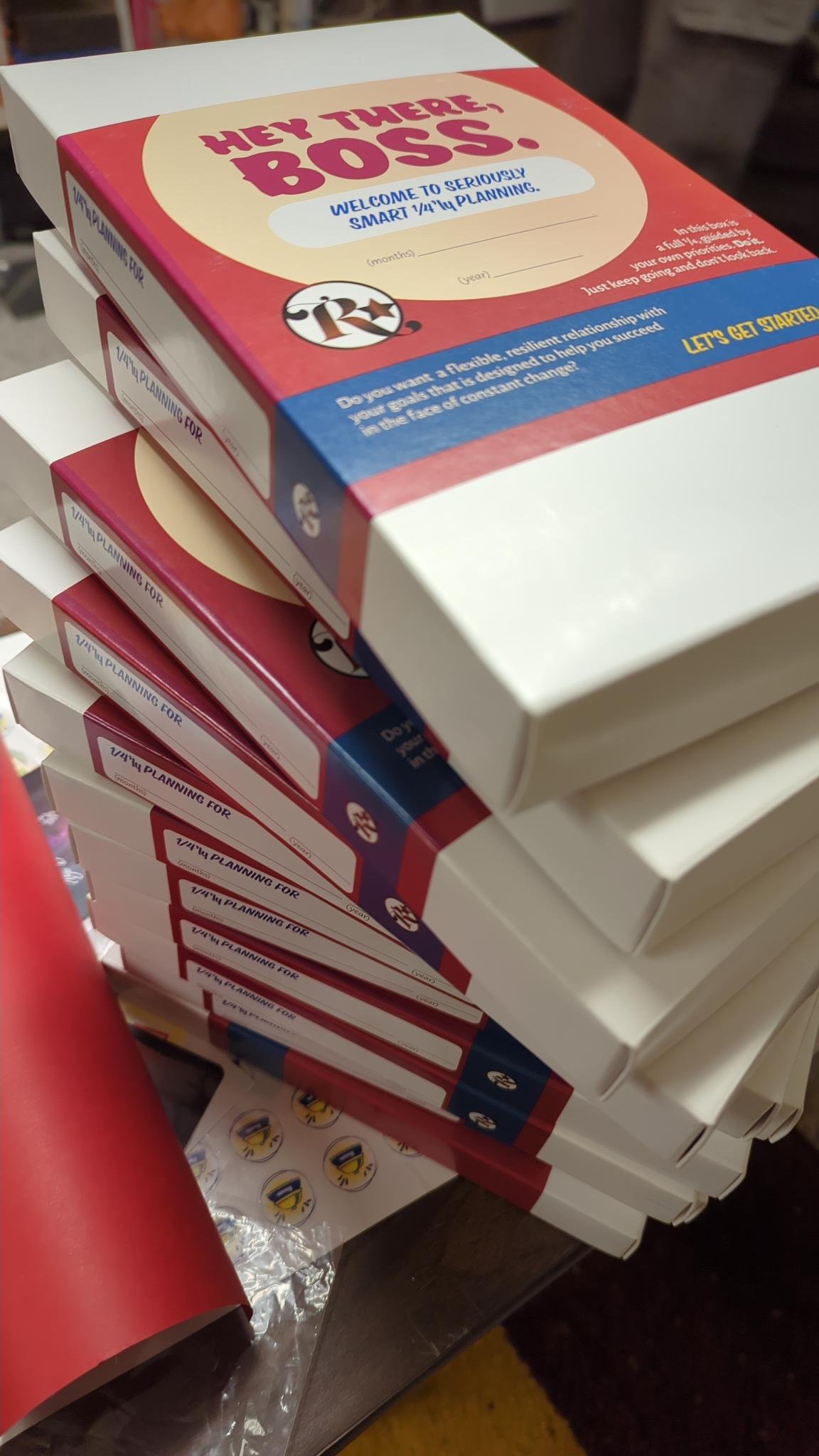 Stack of Just Keep Going ADHD goal-setting workbooks designed to help adults navigate change, clarify priorities, and create meaningful momentum.