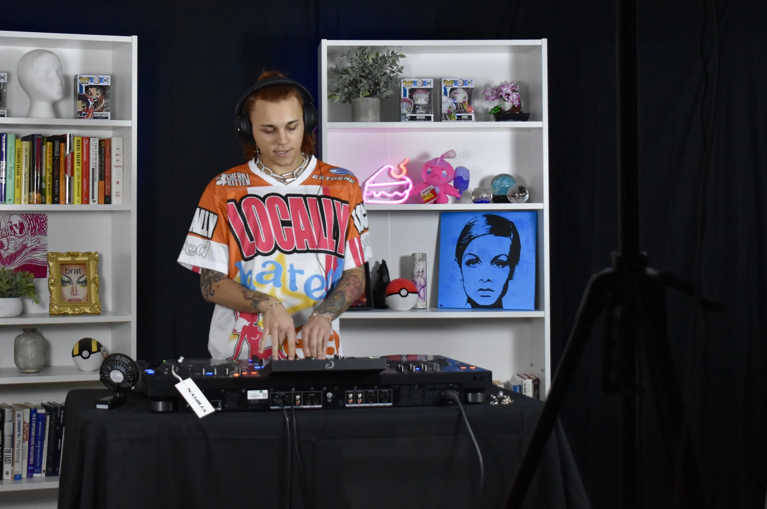 DJ Amethyst records a music video in the studio.