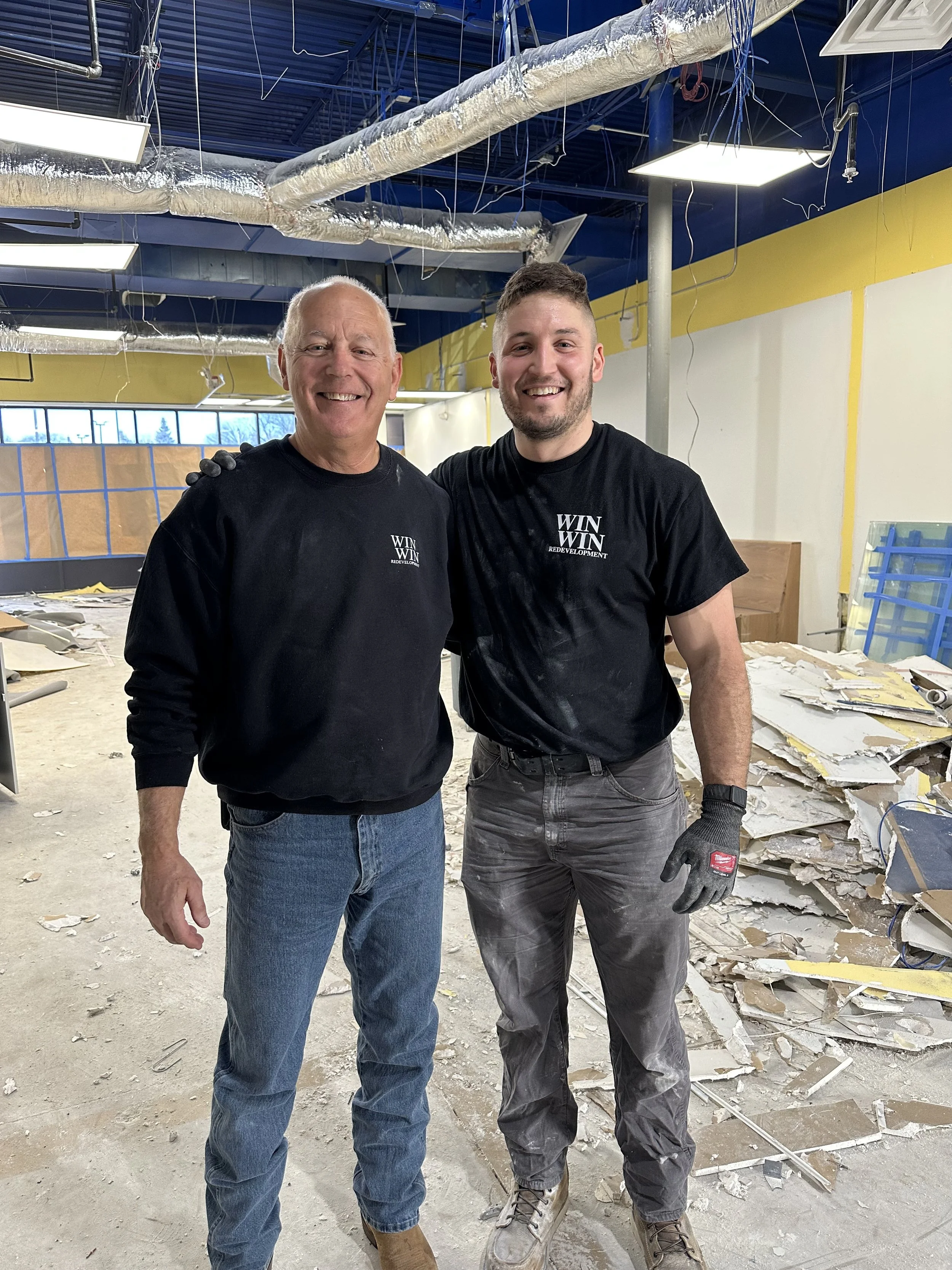 Art and Artie smiling in a construction zone