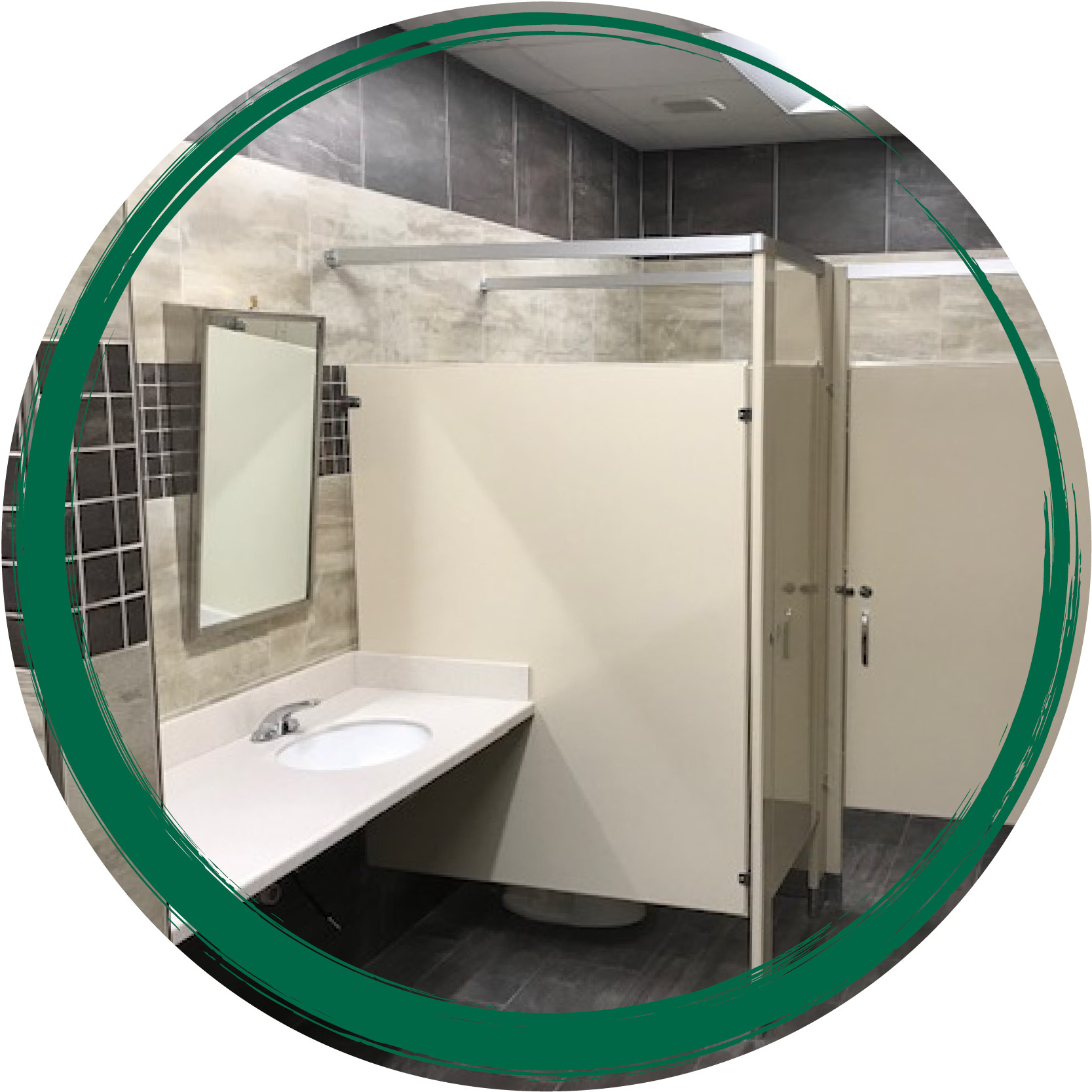 commercial bathroom stall, tile wall and mirror above sink