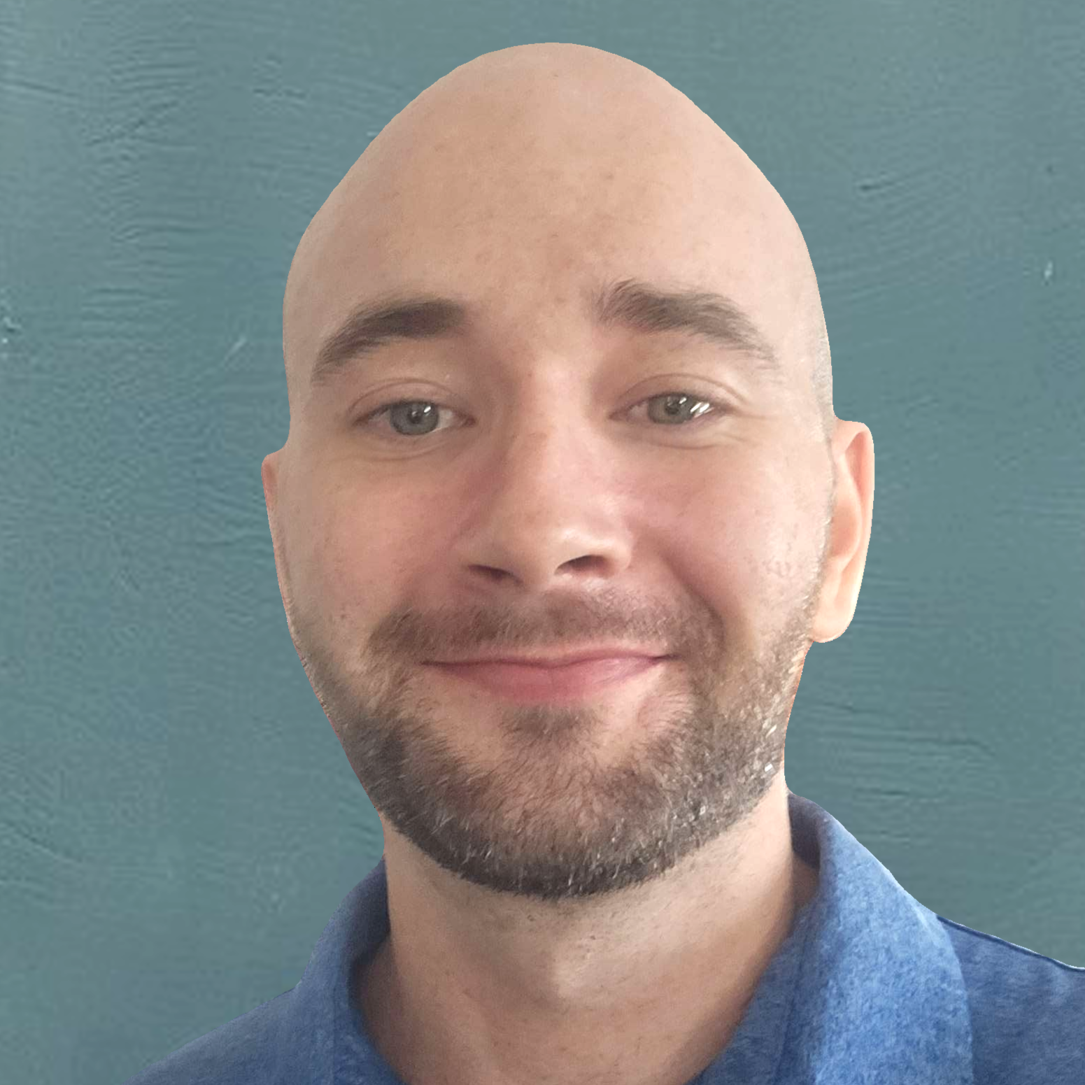 A man with a bald head, light skin, a beard, smiling with a blue shirt against a textured teal background.