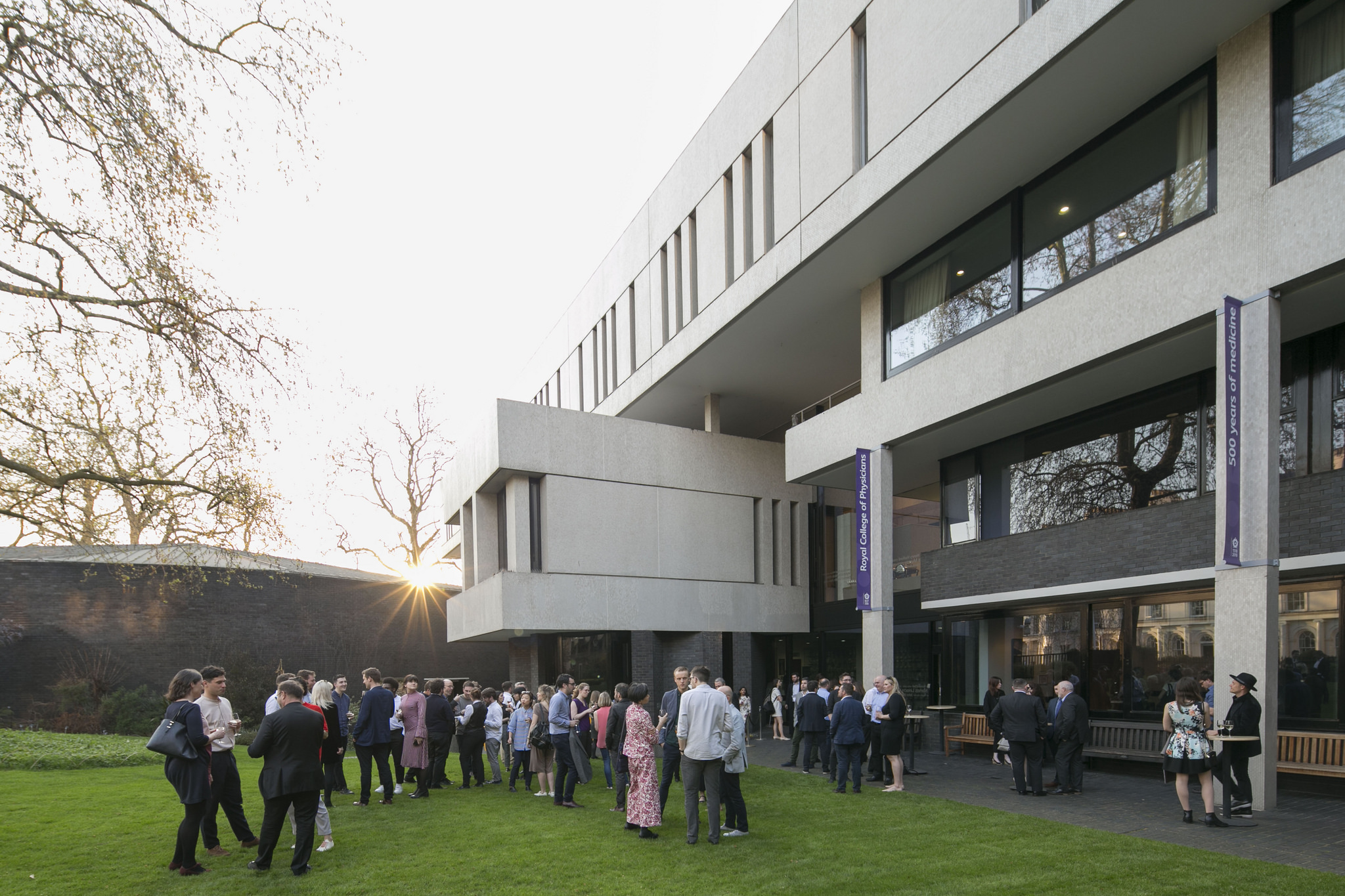 Gala guests enjoy the setting summer sun in the RCP garden
