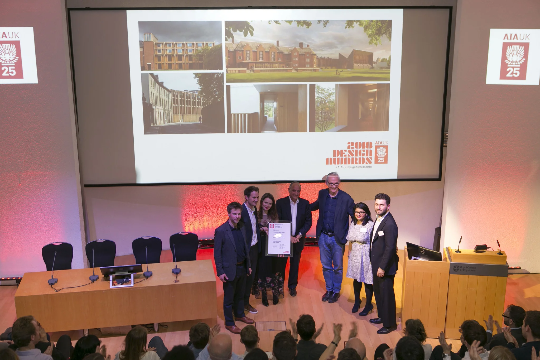 Naill McLaughlin and team accept the Professional Award for West Court Phase 1, Jesus College, with juror Giancarlo Alhadeff, AIA UK President Alex Miller, and AIA UK Vice President Amrita Raja.