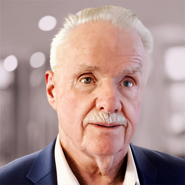 Portrait of a smiling Jim Sanders wearing a white collared shirt and a navy blazer.