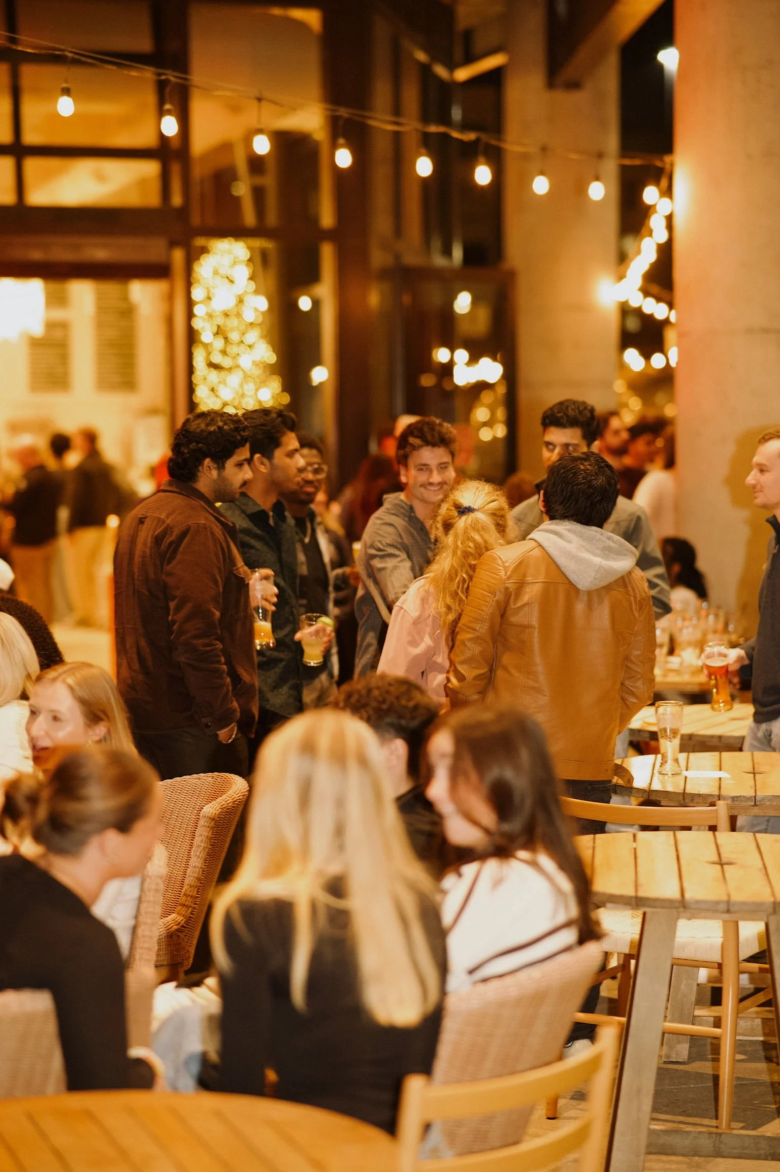 Attendees networking at 704 Collective's launch event at Sycamore Brewing in Charlotte