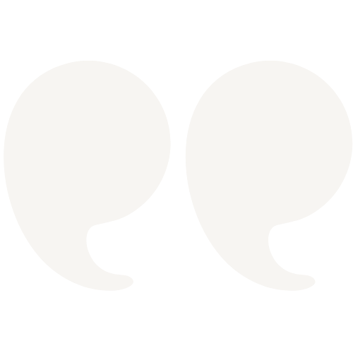 Two white quotation marks on a black background