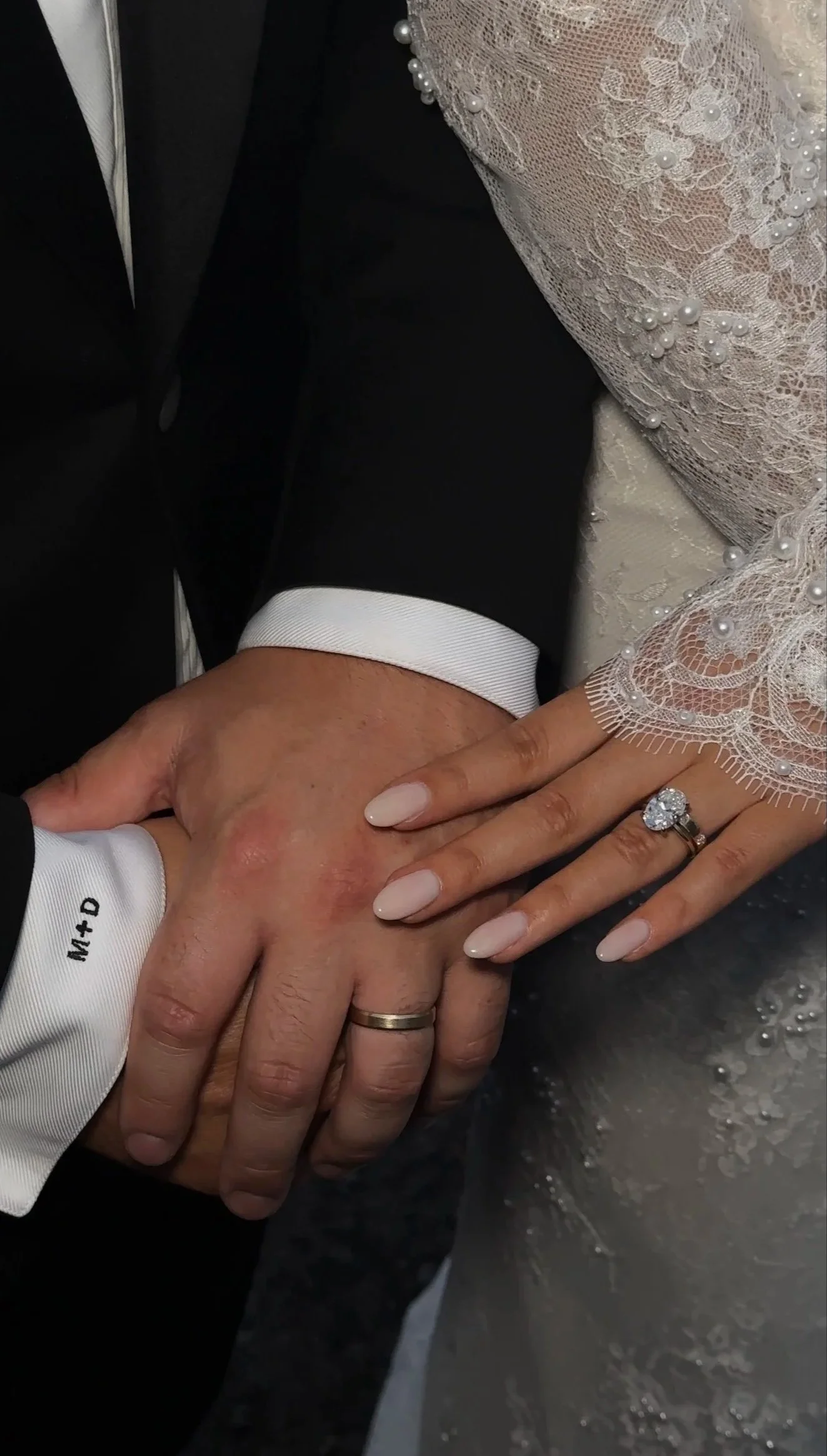 Laurie’s customers, Fernando and Kate embracing by the lake on their wedding day.