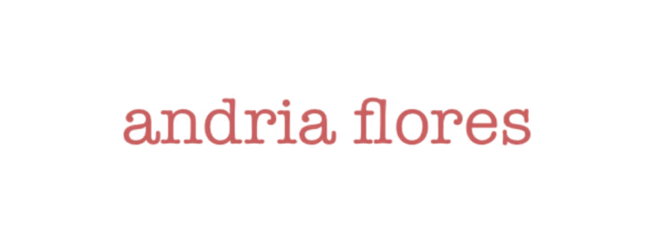 Text reading 'andria flores' in red with a small black dot above 'a', on a white background.