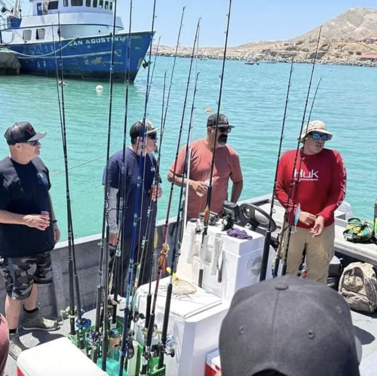 Fishing boat rigged with rods in the Cedros harbor before heading out.