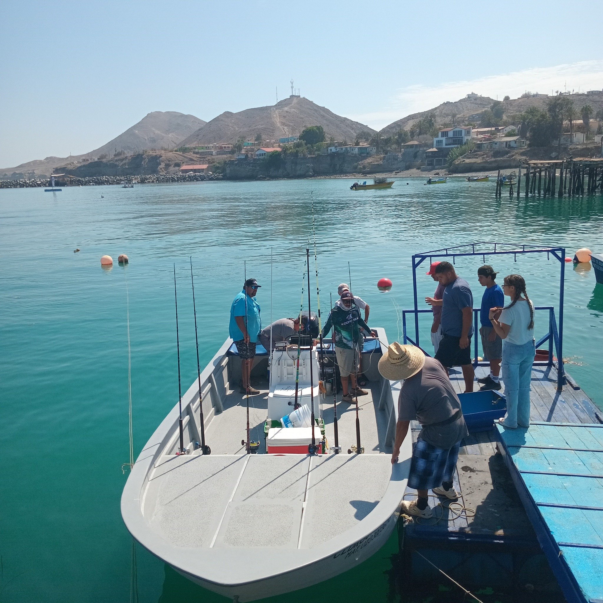 Crew and guests loading rods and gear before a Cedros Island sportfishing trip in Baja California, Mexico.