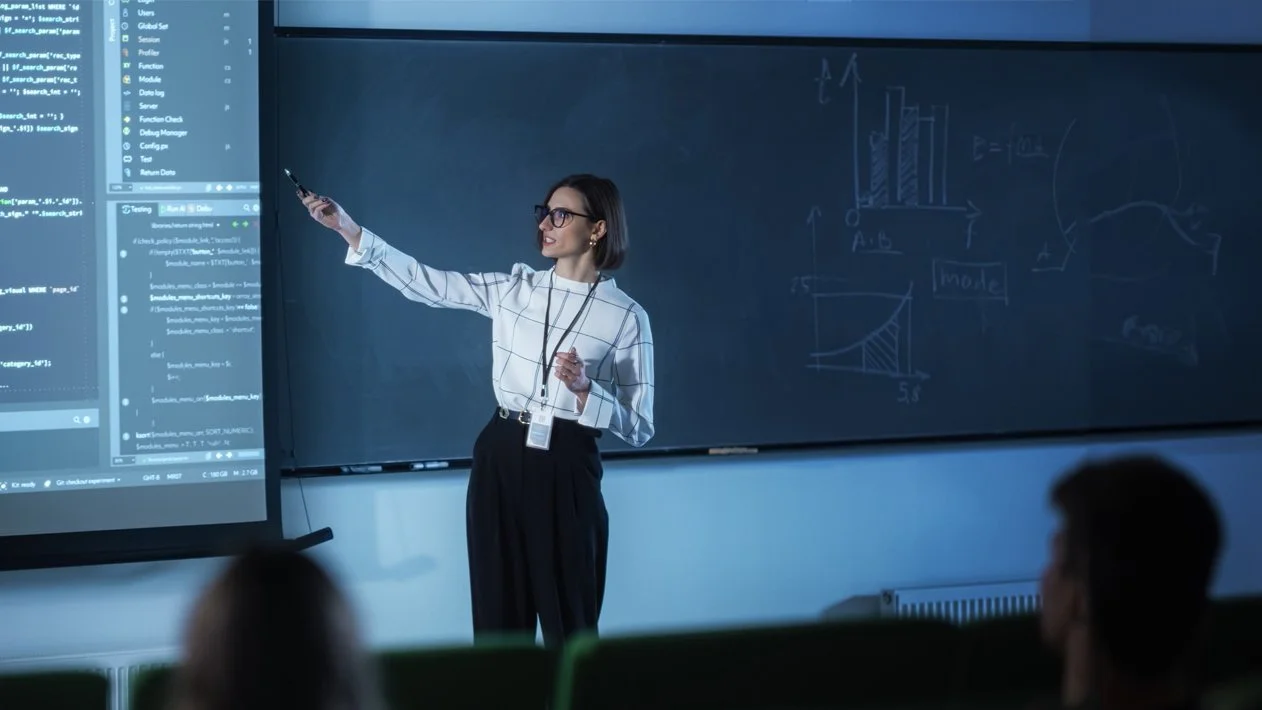 A woman points to a presentation