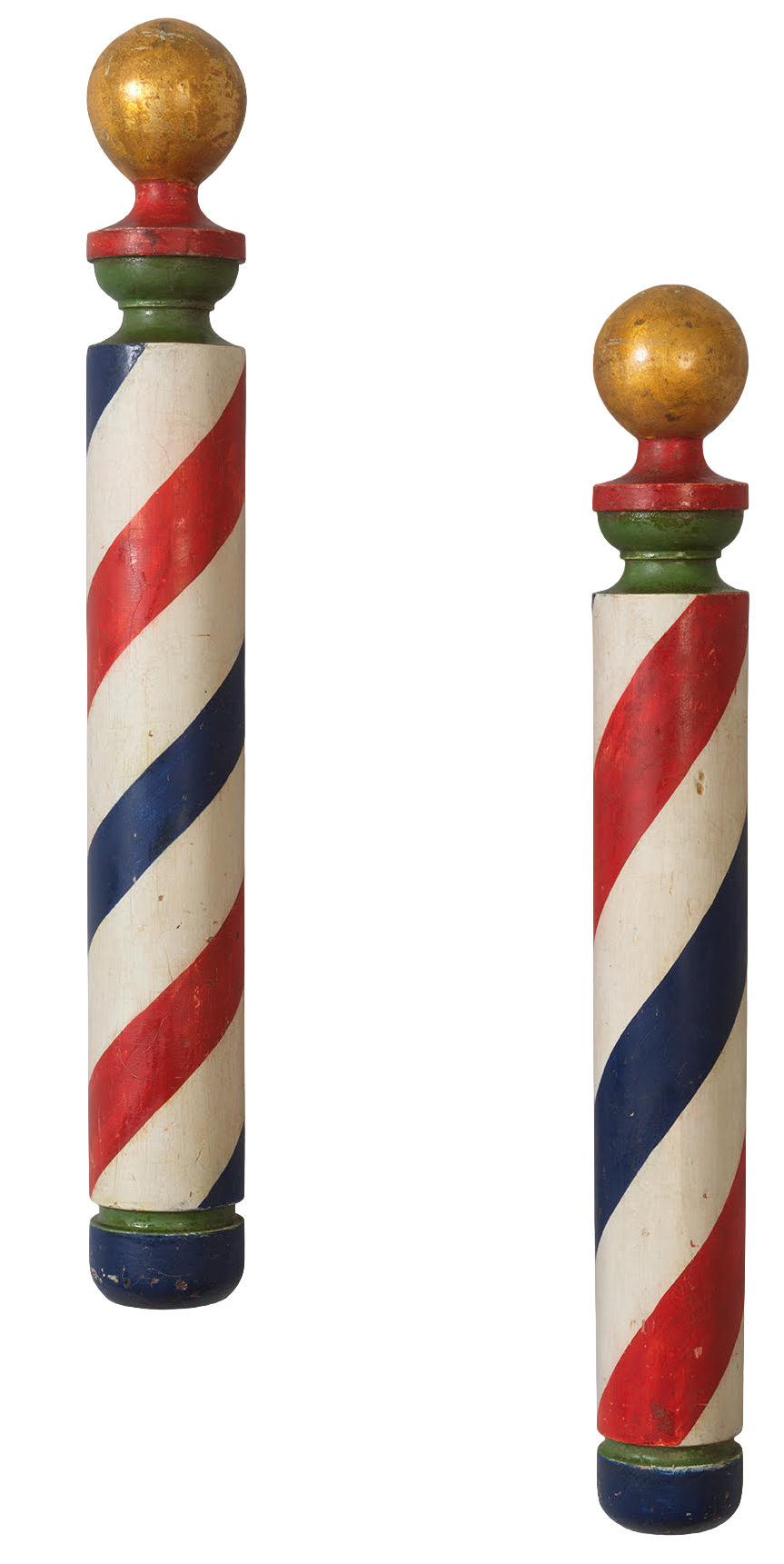 Two vintage barber poles with red, white, and blue stripes, topped with gold spheres, standing side by side.