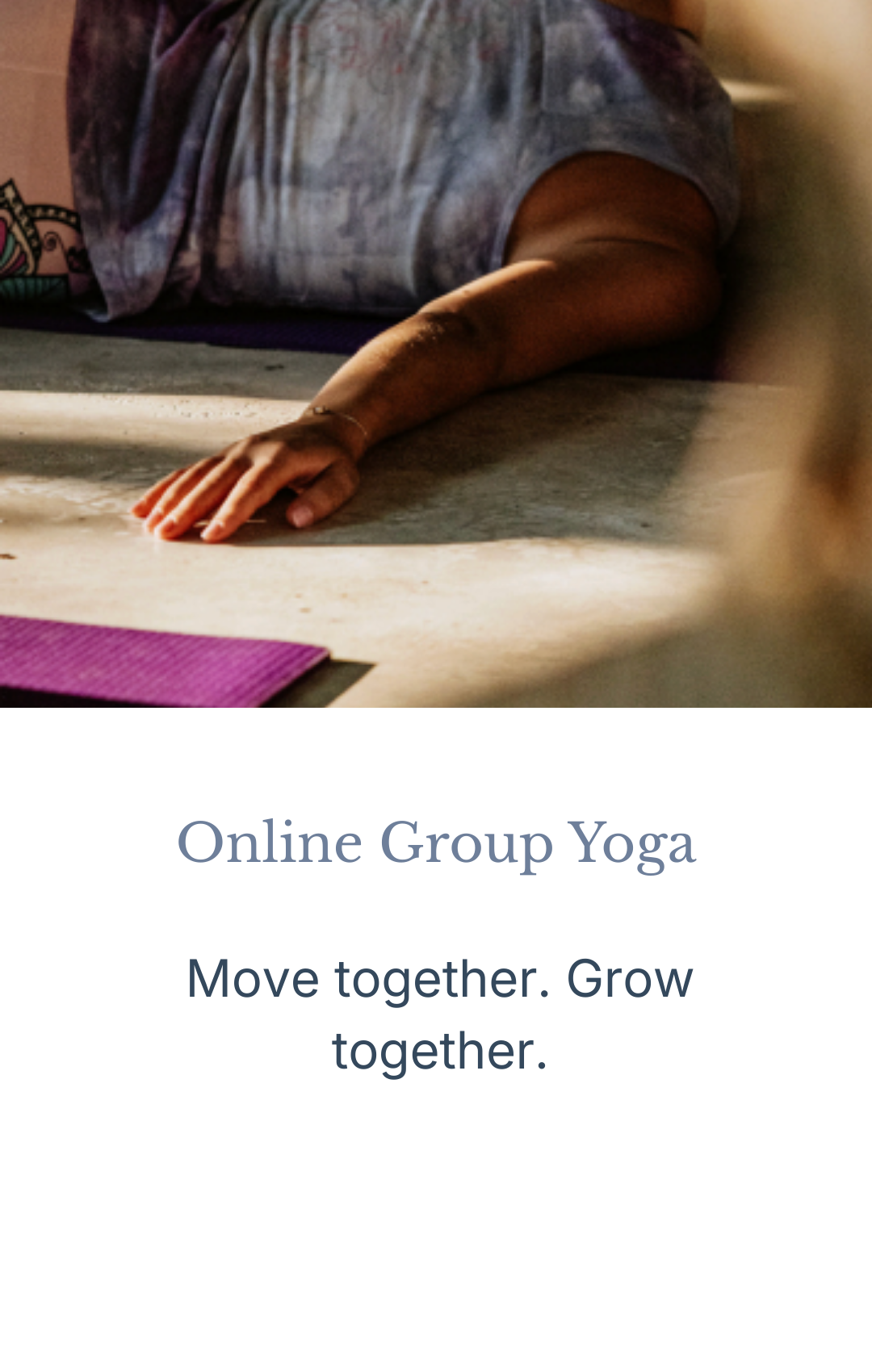 Person doing yoga on a purple mat, lying on their side with one arm extended forward and wearing a t-shirt with colorful graphic design.