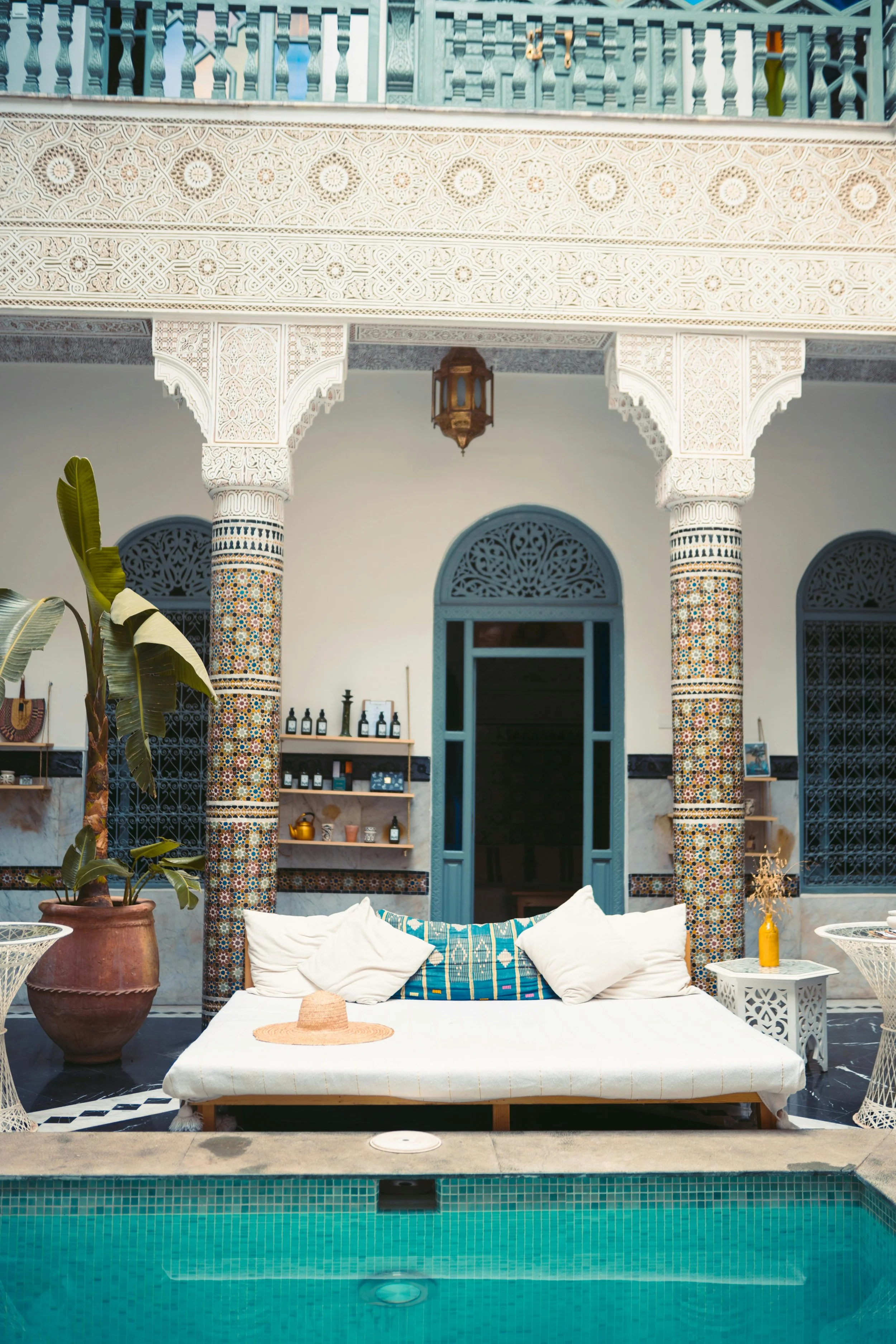 Bali bed beside the pool of a luxury riad in Morocco