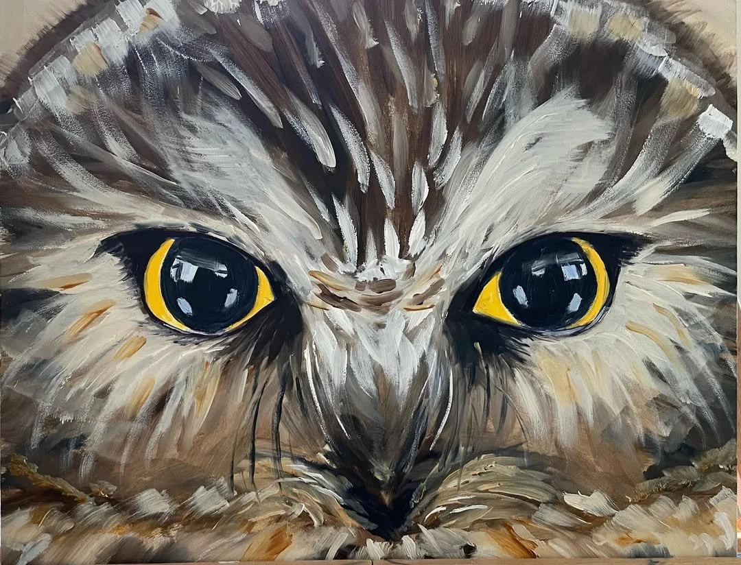 Close-up of a detailed painted kitten's face with yellow and black eyes.