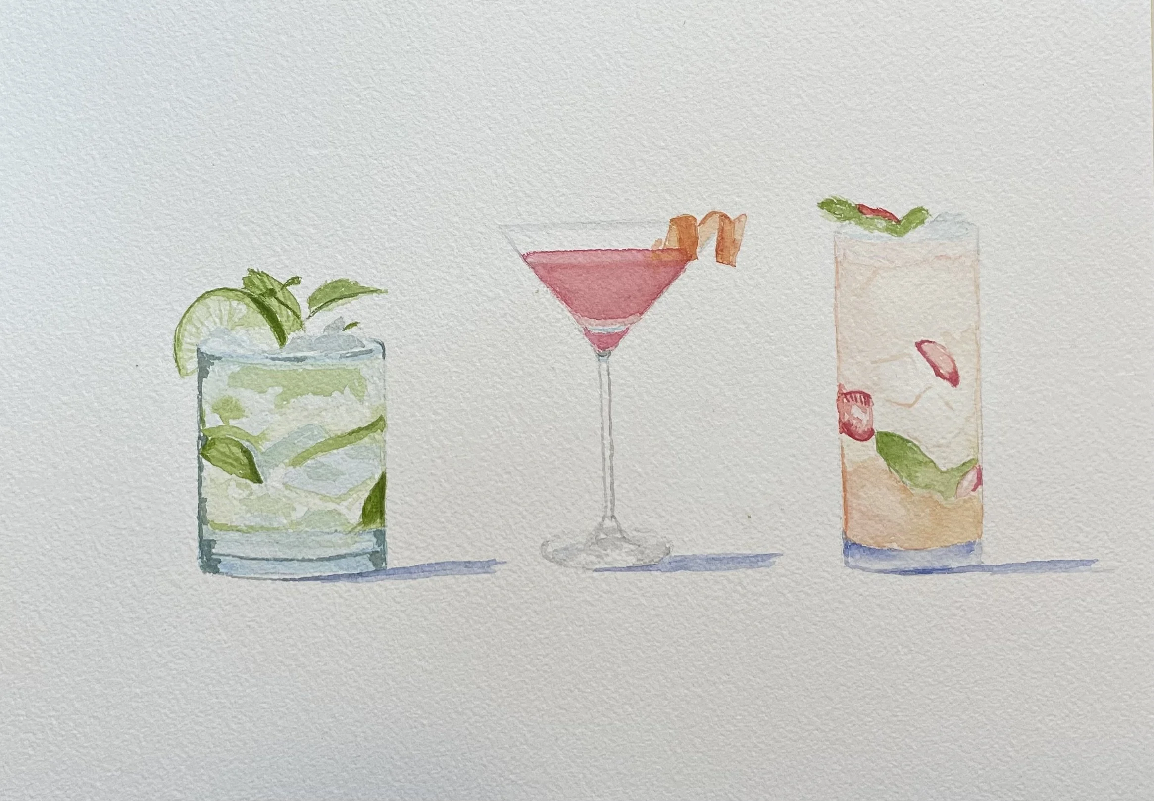 Watermelon and mint cocktail in a tall glass, pink martini in a stemmed glass with orange peel garnish, and another cocktail with fruit slices and mint leaves in a tall glass.