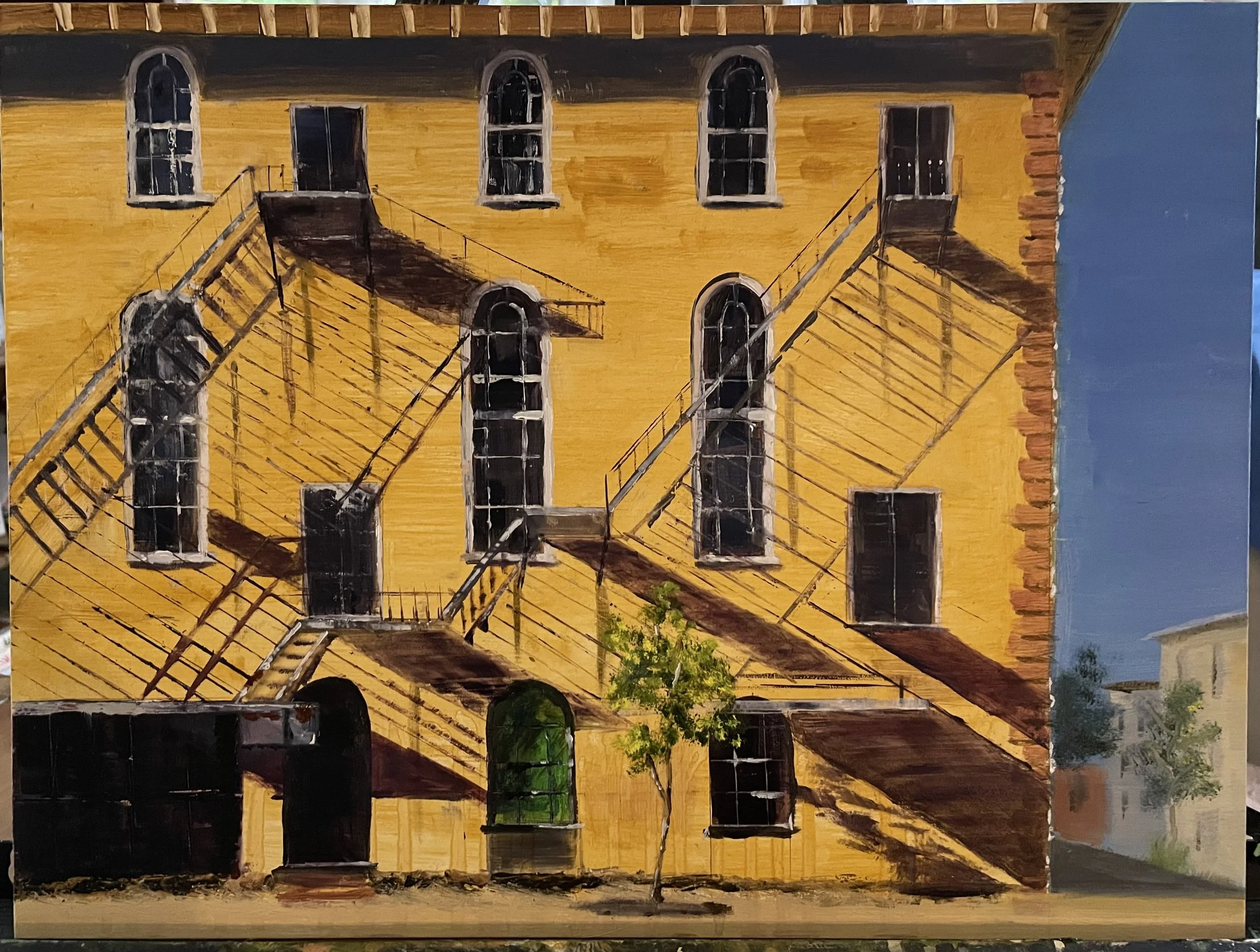 Painting of a yellow brick building with fire escapes, several windows, and a small tree in front.