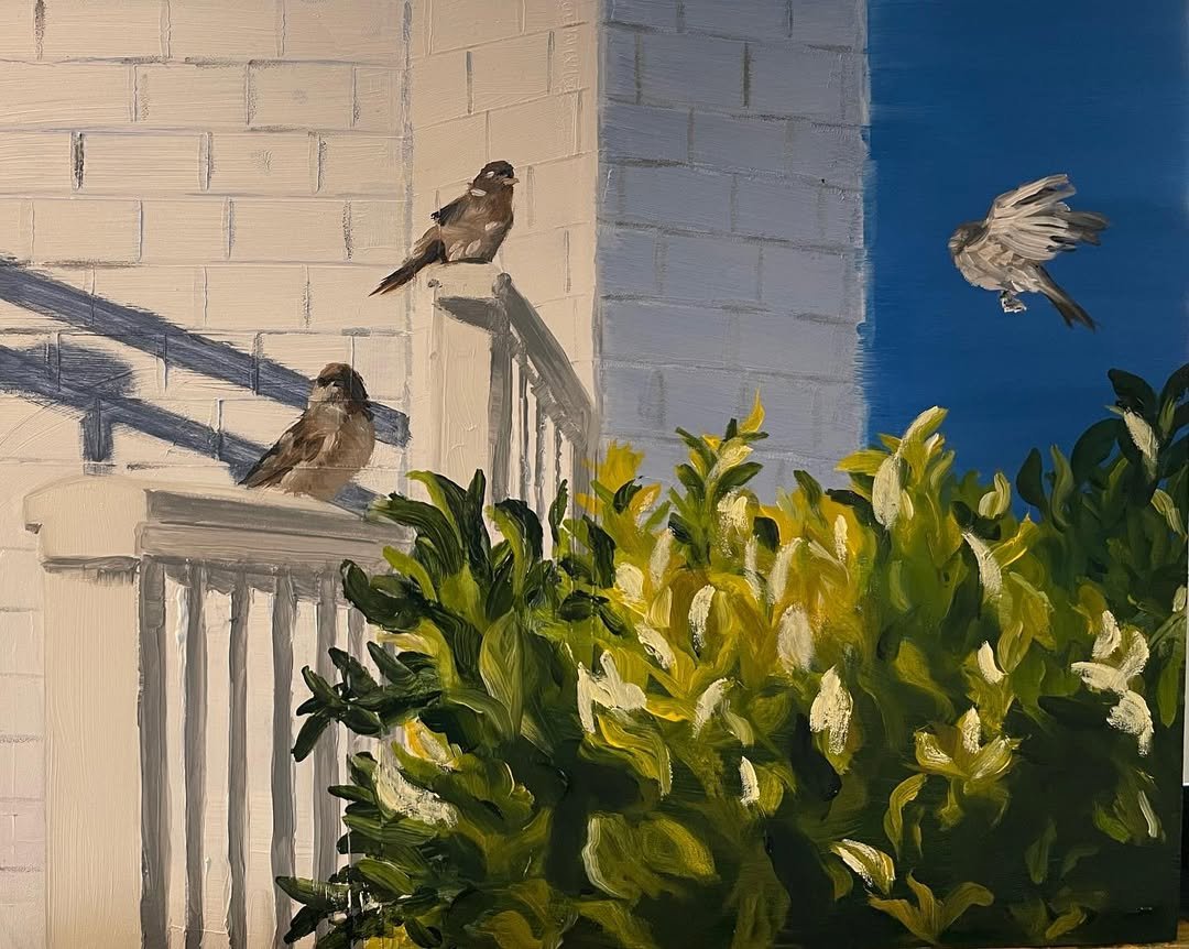 Painting of two birds sitting on a porch railing and one bird flying in the sky, with a lush green bush in the foreground and a building wall in the background.