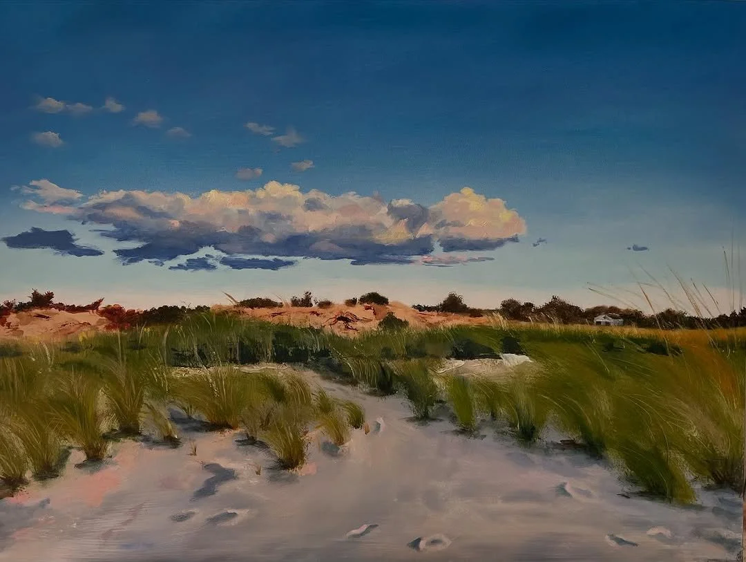 A painted landscape of sandy dunes with green grass, a few trees, and a partly cloudy sky.