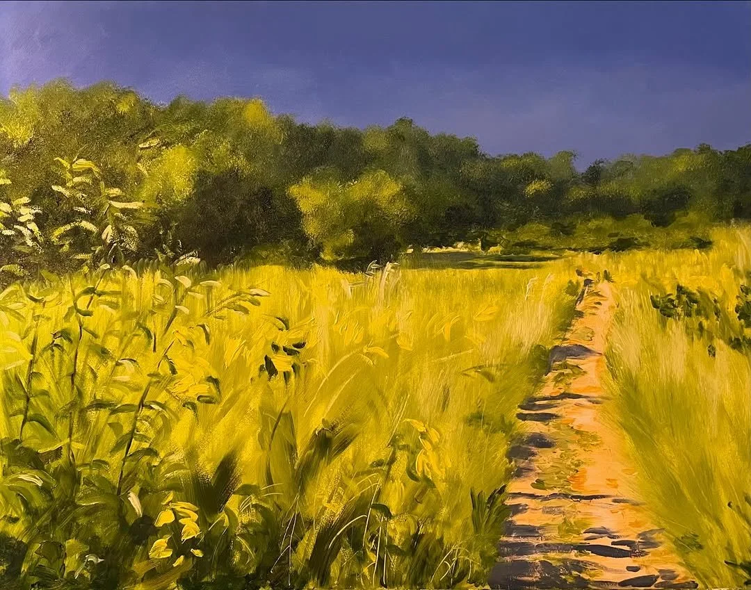 Oil painting of a dirt path through a lush yellow field with green trees in the background and a purple sky.