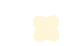 A light-colored teddy bear-shaped object with a rounded, four-petal flower outline.