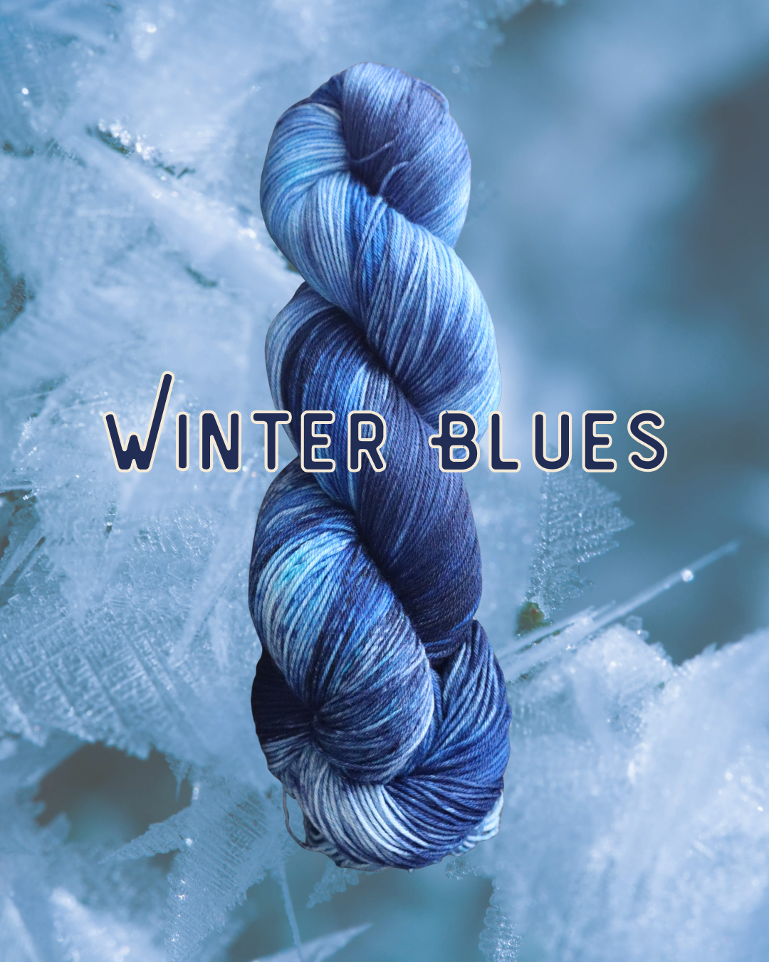 Close-up of a skein of blue, white, and navy variegated yarn with icy branches background image and the text 'Winter Blues' overlaid.