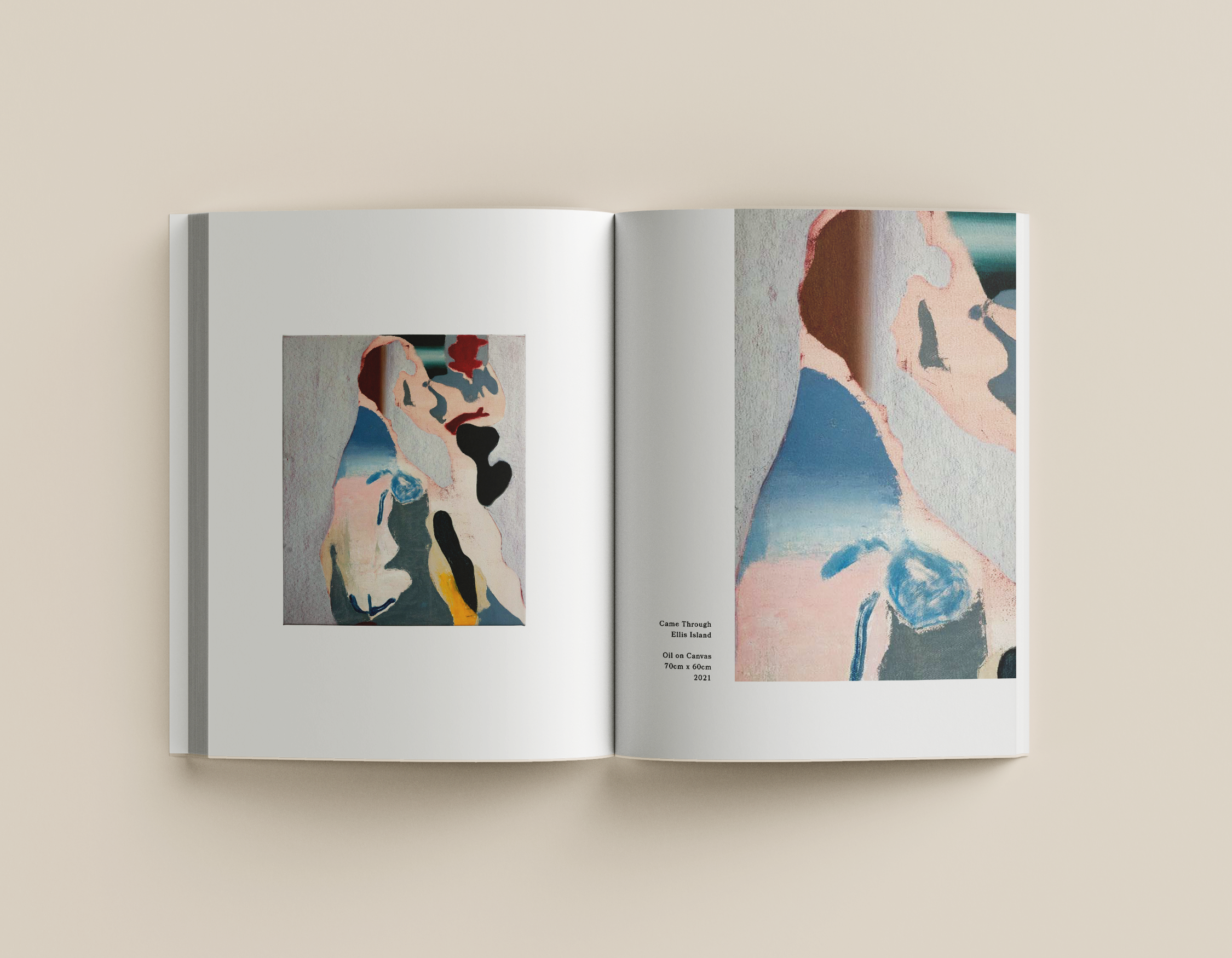 An open art book showing abstract paintings of human faces and figures.