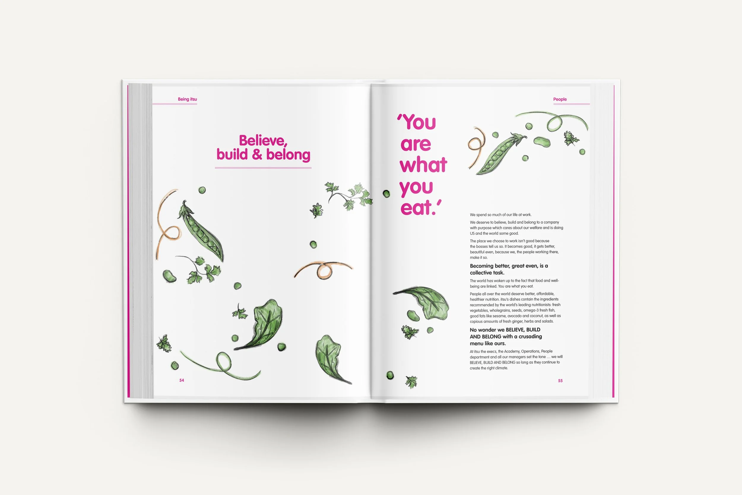 Open magazine spread with illustrations of green leafy vegetables and herbs, featuring bold pink text that says, 'Believe, build & belong' and a quote, 'You are what you eat.'