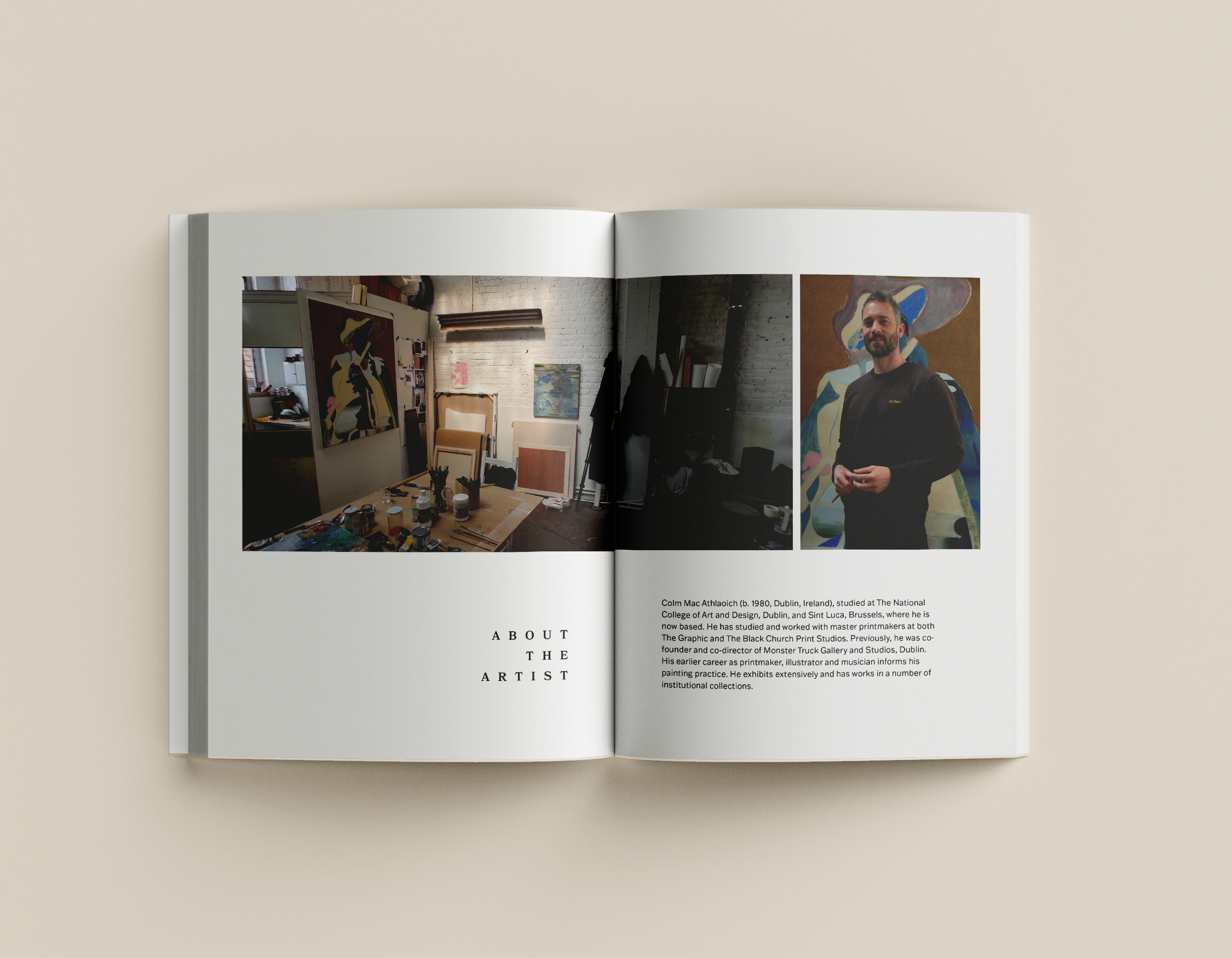 Open art portfolio book featuring three photographs: an art studio with paintings, a darker studio space, and a man standing in front of a colorful abstract painting.