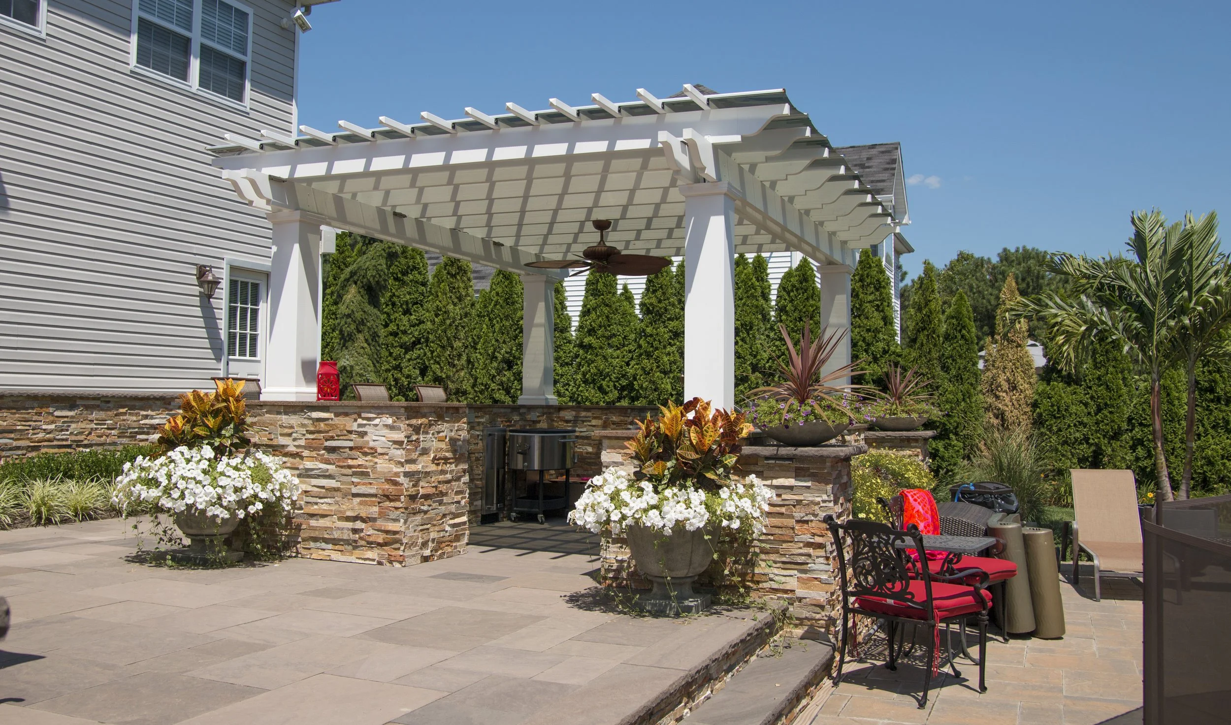 Custom outdoor cabana integrated into a luxury backyard in Long Island, NY