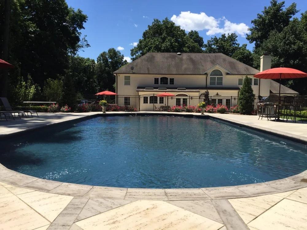 Landscaping design featuring tidy borders and a polished curb appeal look in Port Washington, NY