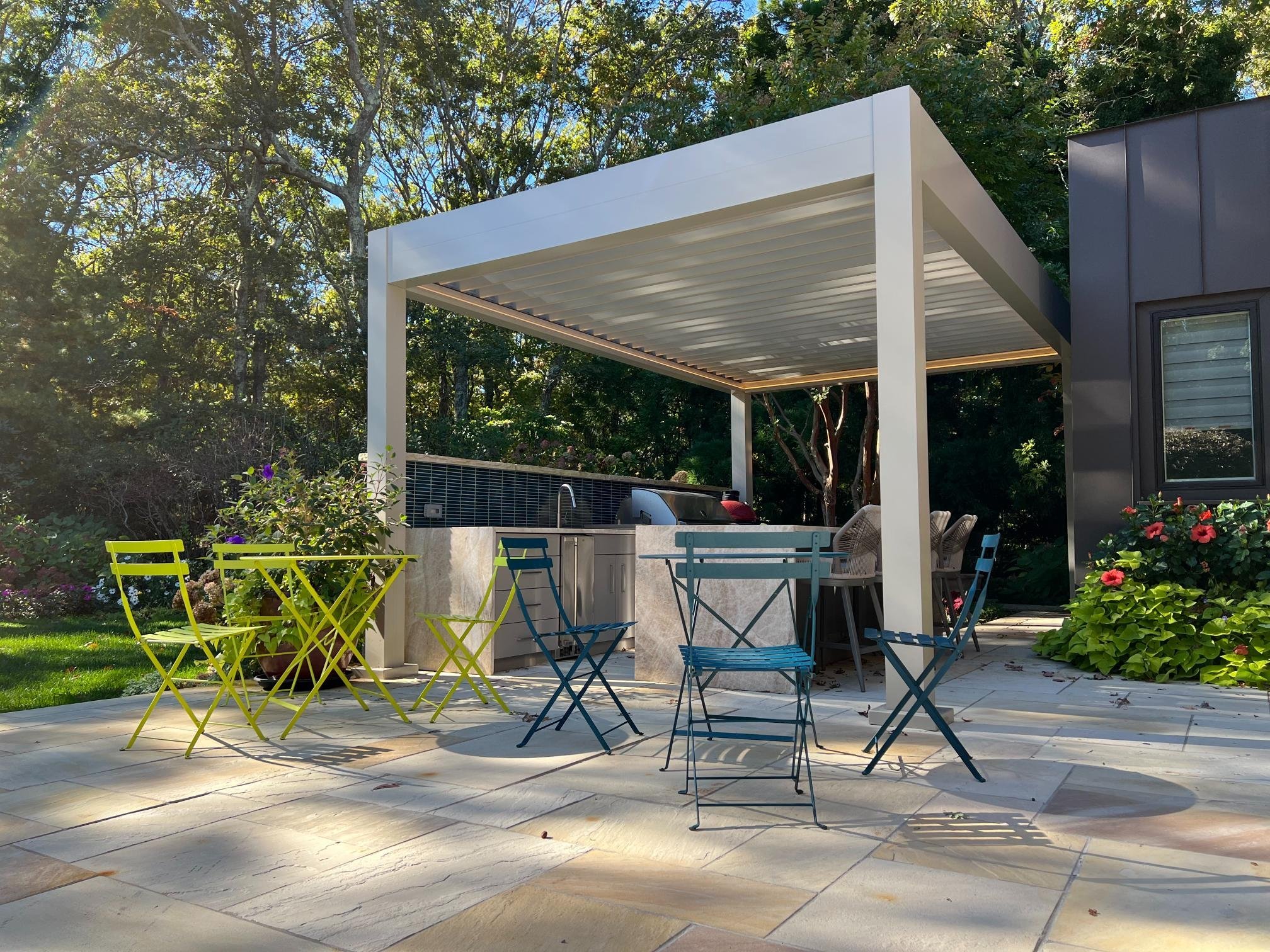 Motorized louvered pergola enhancing year-round outdoor comfort in Long Island, NY